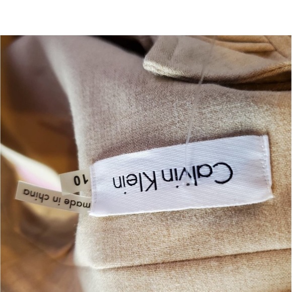 Calvin Klein Tan Ruffle Collar V Neck Sleeveless Pleated Fit and Flare Dress - Picture 11 of 11